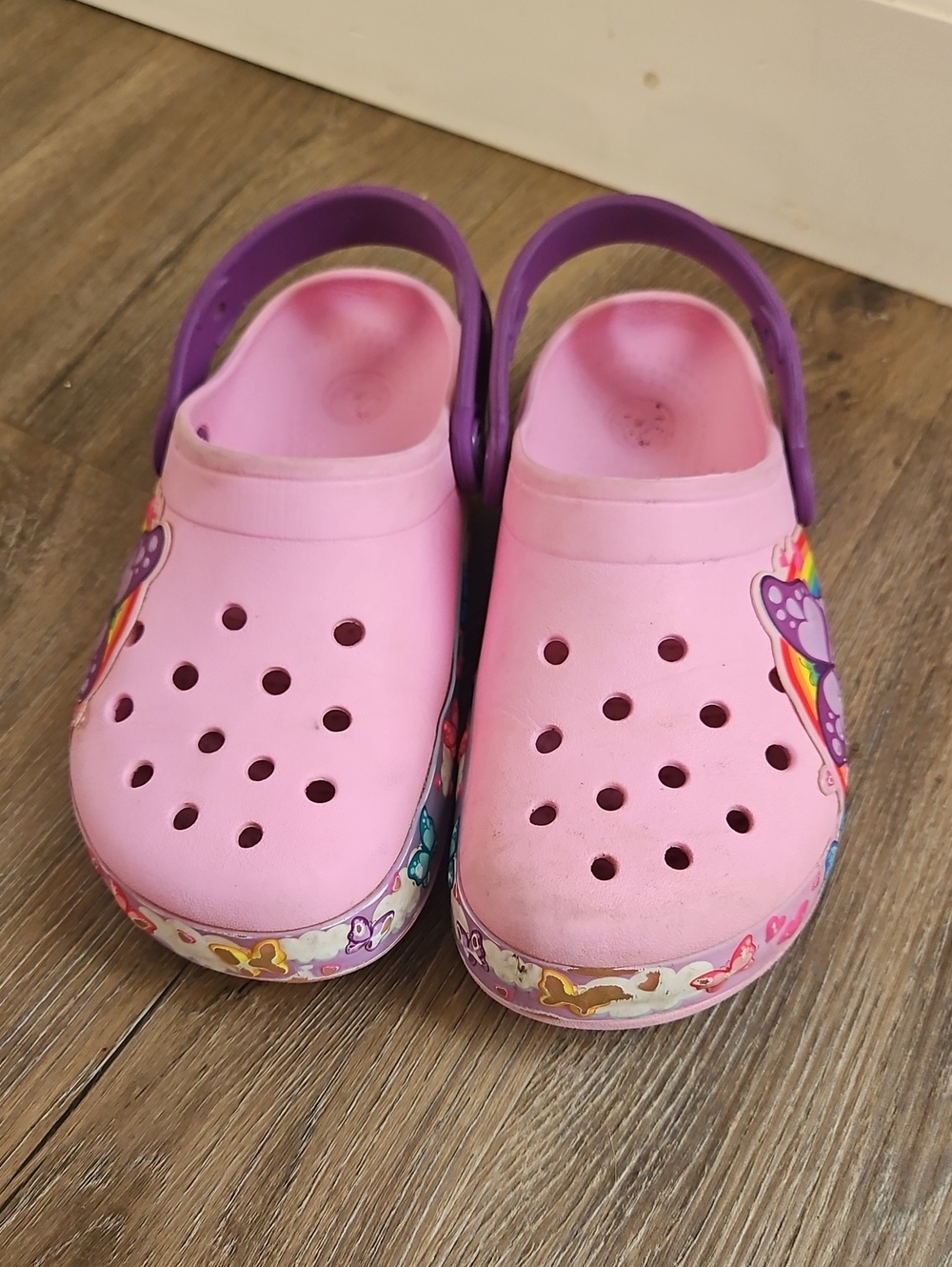 CROCS Pink Clog Sandals with Purple Heel Strap Rainbow and butterfly design